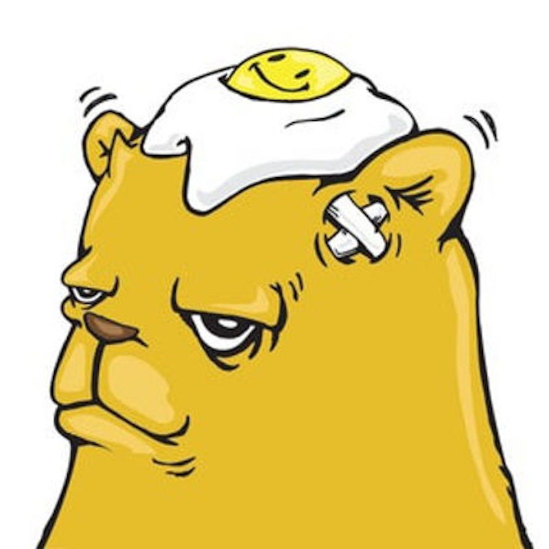 A yellow cartoon bear with a bandage on head.