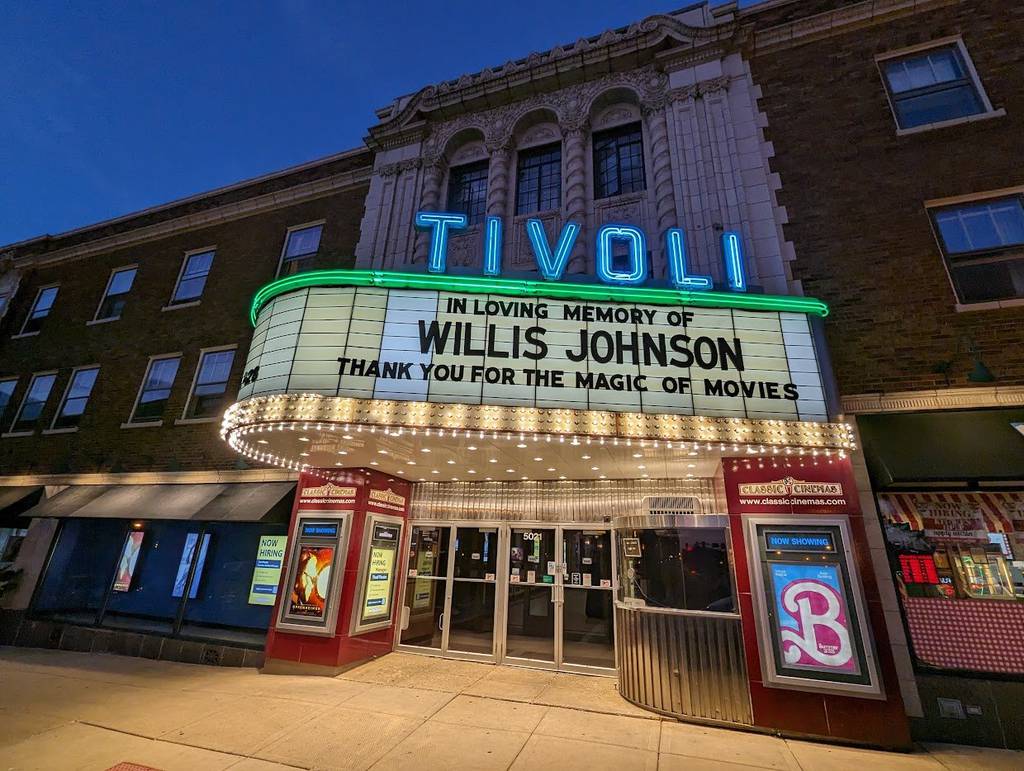 Photo of Tivoli movie theatre marquee lit up during evening light 